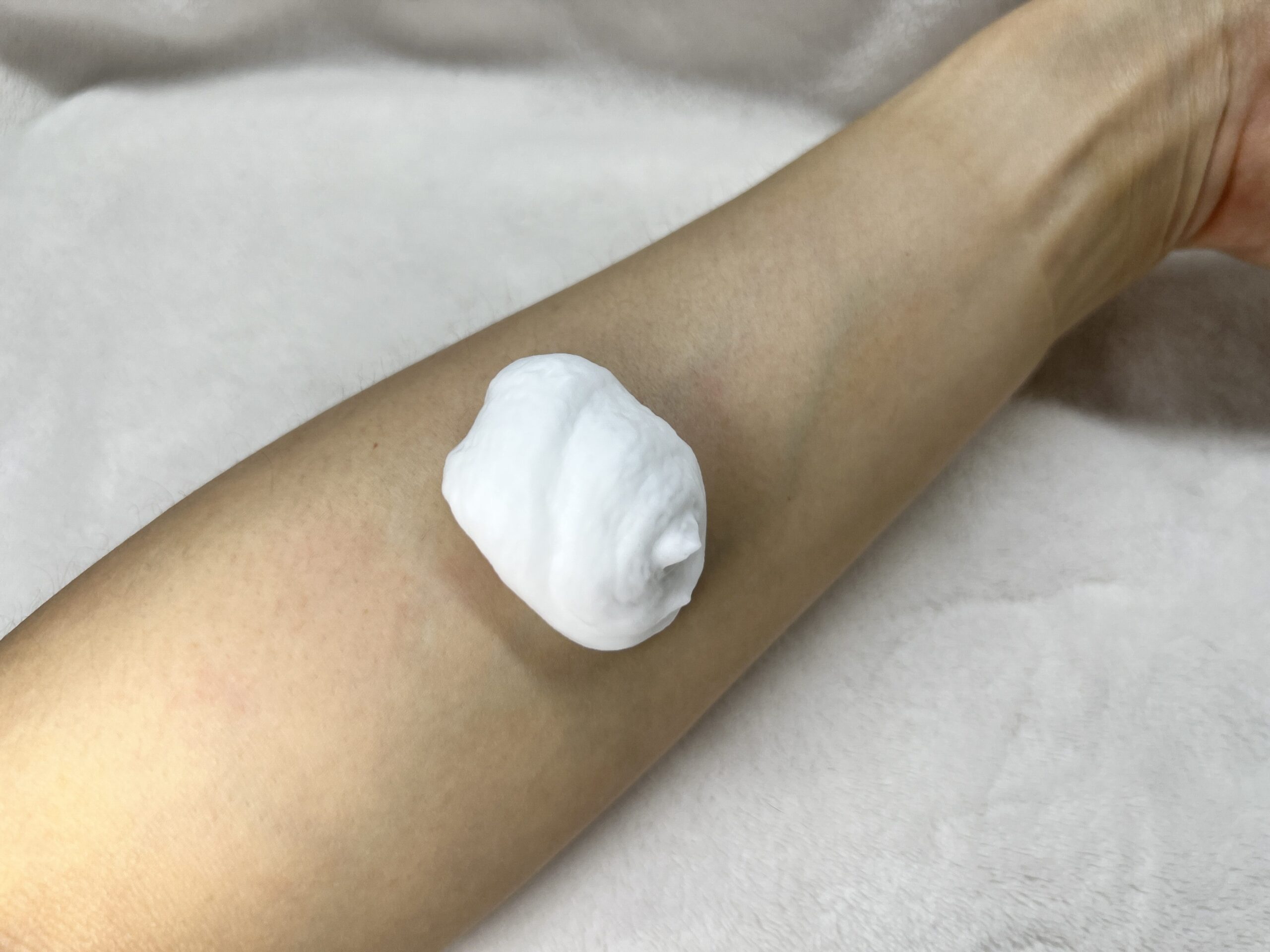 Mousse being freshly dispensed onto the arm