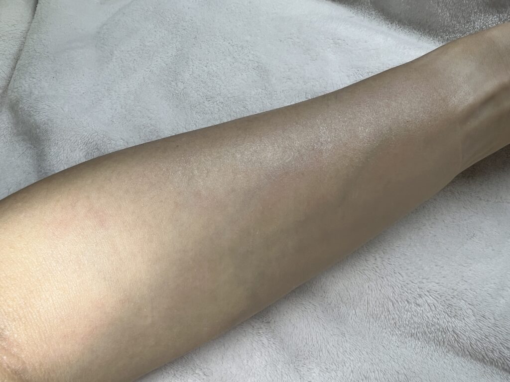 TIRTIR mousse sunscreen foam texture on arm