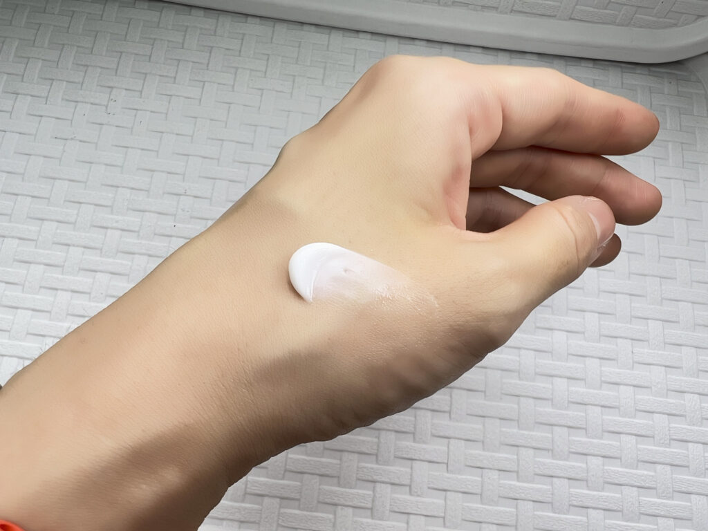 Applying moisturizer for dewy skin routine