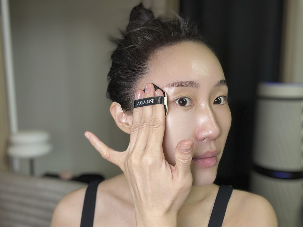 Applying foundation with a sponge over skin after base prep