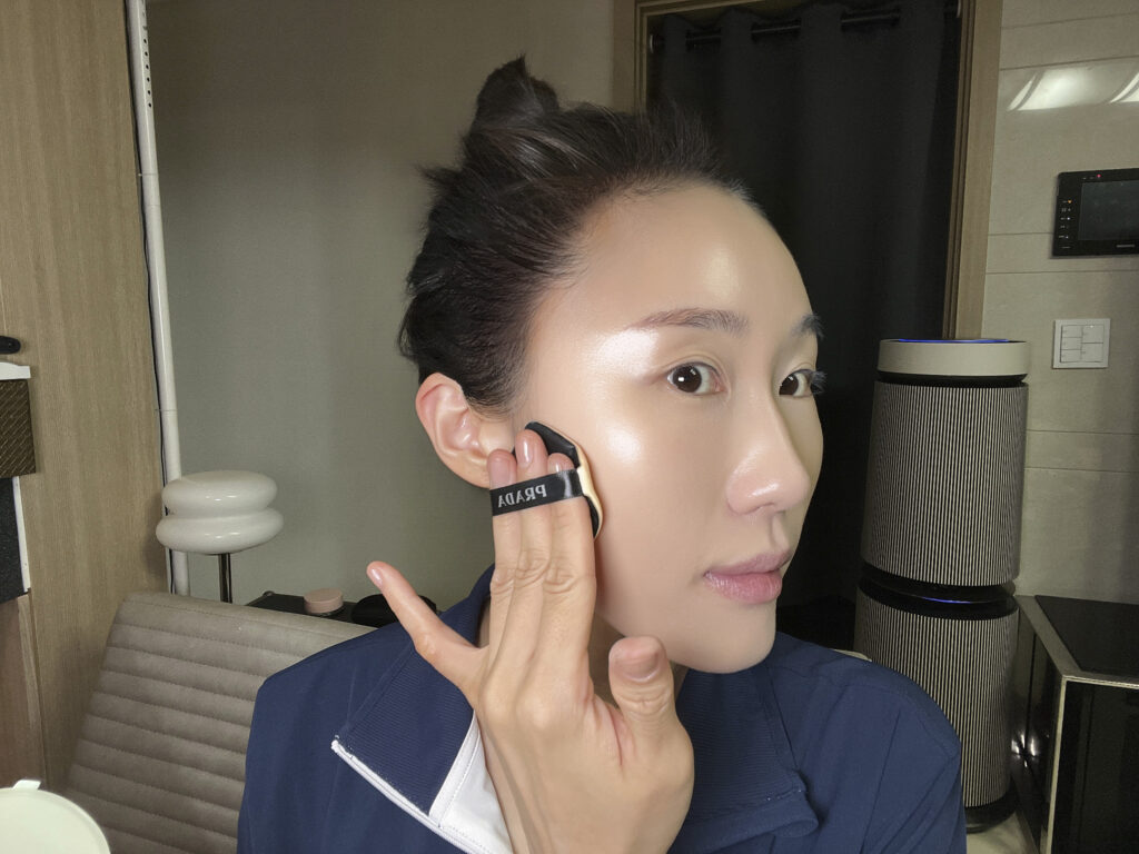 Applying cushion foundation over Theraderm Silky Nude SPF 50+ to test makeup compatibility